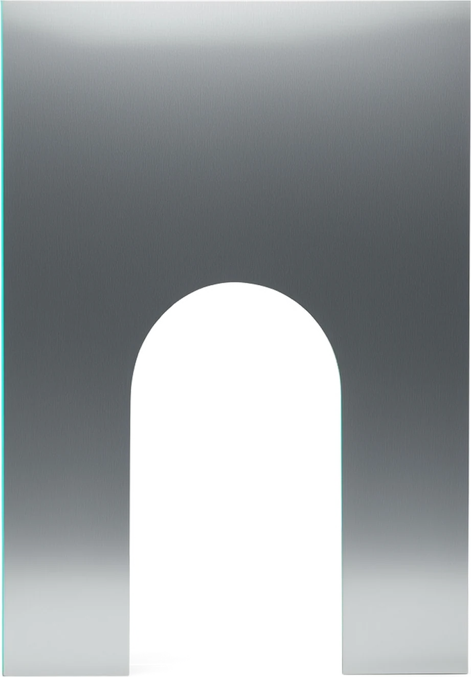 An engraved keepsake plate standing face on in cool light